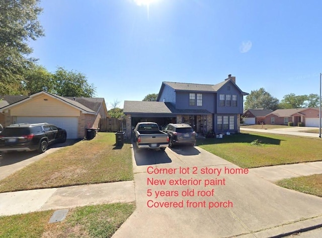 5155 Verdenbruk Dr, Houston, TX 77066 - traditional-style house with concrete driveway, a front yard, and a chimney