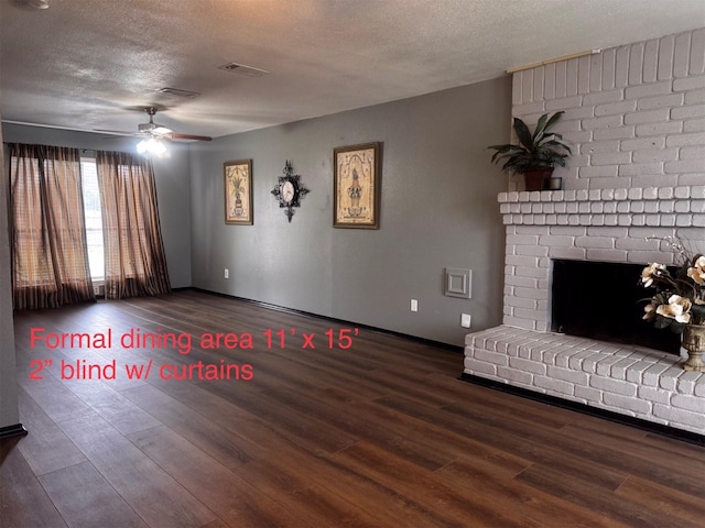 5155 Verdenbruk Dr, Houston, TX 77066 - unfurnished living room featuring wood finished floors, a textured ceiling, ceiling fan, and a fireplace