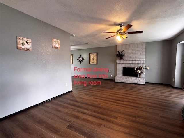 5155 Verdenbruk Dr, Houston, TX 77066 - unfurnished living room with ceiling fan, a textured ceiling, wood finished floors, a fireplace, and a textured wall