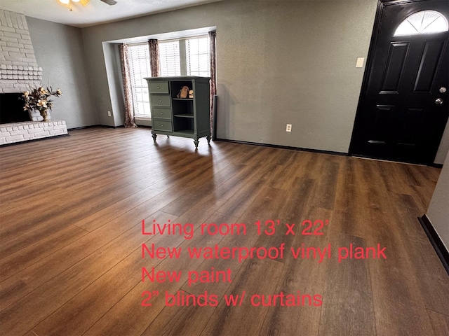5155 Verdenbruk Dr, Houston, TX 77066 - foyer featuring wood finished floors, a brick fireplace, and a ceiling fan