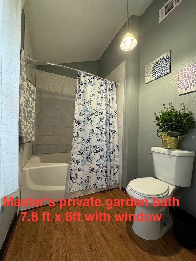 5155 Verdenbruk Dr, Houston, TX 77066 - bathroom with wood finished floors and shower / tub combo