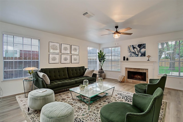 20531 Spring Rose Dr, Katy, TX 77450 - living area featuring healthy amount of natural light, a ceiling fan, and light wood-style floors