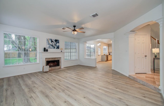 20531 Spring Rose Dr, Katy, TX 77450 - unfurnished living room with ceiling fan, light wood-style flooring, and healthy amount of natural light