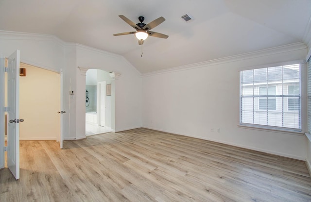 20531 Spring Rose Dr, Katy, TX 77450 - spare room featuring vaulted ceiling, ceiling fan, arched walkways, light wood finished floors, and ornamental molding