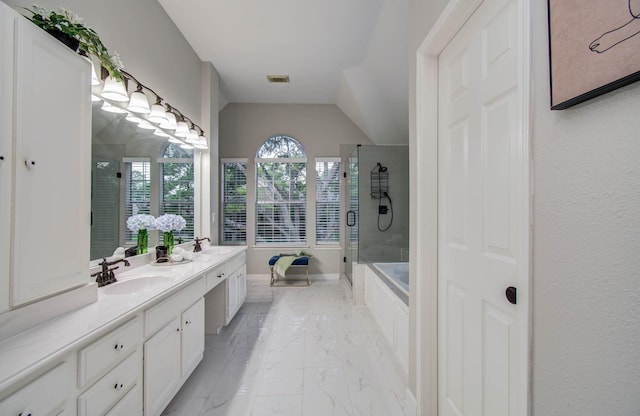 20531 Spring Rose Dr, Katy, TX 77450 - bathroom with a bath, double vanity, marble finish floors, a stall shower, and vaulted ceiling