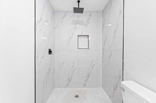 327 E Delz Dr, Houston, TX 77022 - bathroom featuring toilet and a marble finish shower