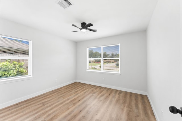 327 E Delz Dr, Houston, TX 77022 - spare room featuring light wood-type flooring and a ceiling fan