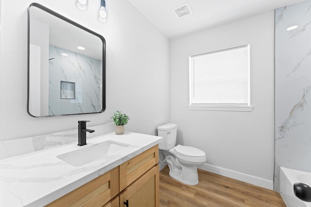 327 E Delz Dr, Houston, TX 77022 - bathroom featuring vanity and wood finished floors