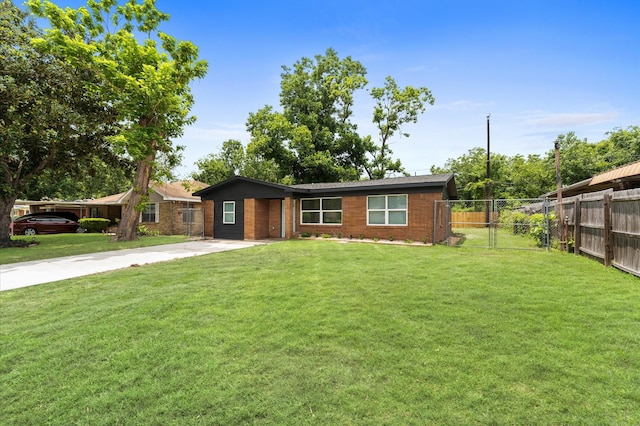 327 E Delz Dr, Houston, TX 77022 - single story home with driveway and brick siding