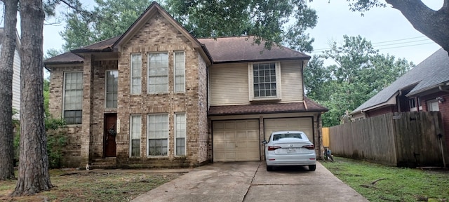 14631 Saint Cloud Dr, Houston, TX 77062 - view of front of property with concrete driveway, a garage, brick siding, and a shingled roof