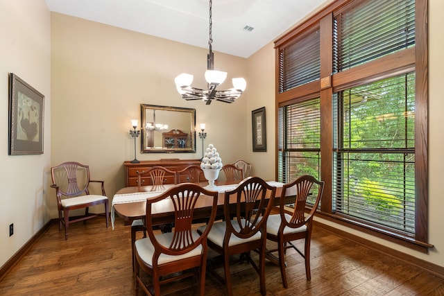 15608 Queen Victoria Ct, Montgomery, TX 77316 - dining room with a chandelier, dark wood-style floors, and a high ceiling