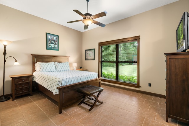 15608 Queen Victoria Ct, Montgomery, TX 77316 - bedroom featuring light tile patterned flooring and a ceiling fan
