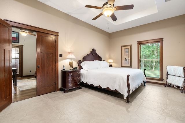 15608 Queen Victoria Ct, Montgomery, TX 77316 - bedroom with ceiling fan and a tray ceiling