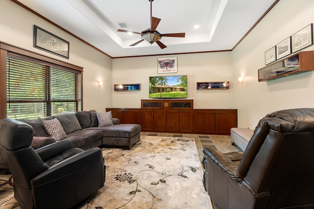 15608 Queen Victoria Ct, Montgomery, TX 77316 - living area featuring ceiling fan, a raised ceiling, and ornamental molding