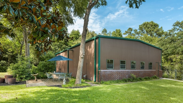 15608 Queen Victoria Ct, Montgomery, TX 77316 - view of side of property featuring a patio area and brick siding
