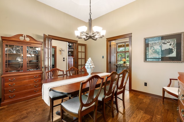 15608 Queen Victoria Ct, Montgomery, TX 77316 - dining area with a chandelier, dark wood-type flooring, and a towering ceiling