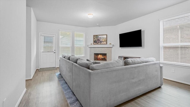 17734 Pensford Way, Tomball, TX 77377 - living room with wood finished floors and a tile fireplace