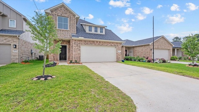 17734 Pensford Way, Tomball, TX 77377 - traditional-style house with brick siding, driveway, and a front lawn