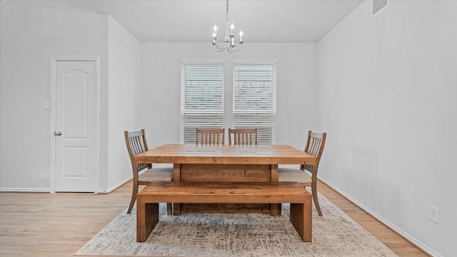 17734 Pensford Way, Tomball, TX 77377 - dining space featuring a chandelier and light wood finished floors