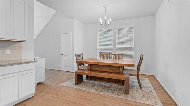 17734 Pensford Way, Tomball, TX 77377 - dining room with light wood-style flooring and a chandelier