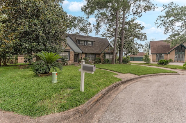 410 Shadywood Cir, Conroe, TX 77304 - view of front of house featuring a front lawn and brick siding