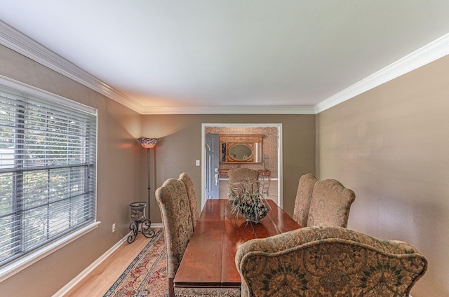 410 Shadywood Cir, Conroe, TX 77304 - dining space with light wood-type flooring and ornamental molding
