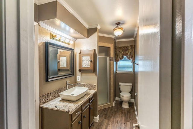 410 Shadywood Cir, Conroe, TX 77304 - full bath featuring vanity, wood finished floors, a shower stall, and ornamental molding