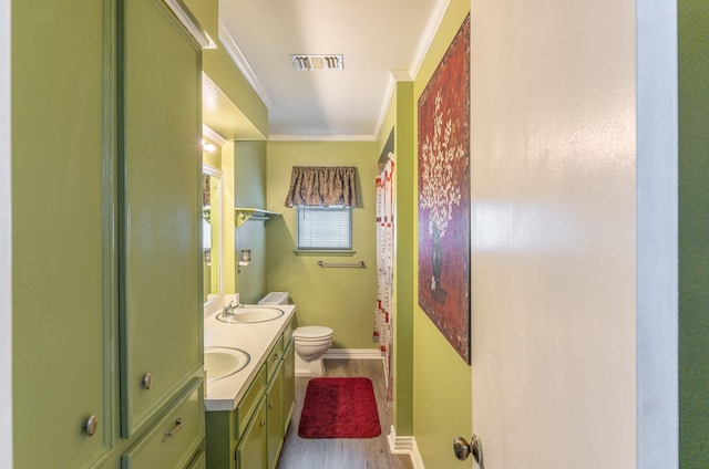 410 Shadywood Cir, Conroe, TX 77304 - full bath with wood finished floors, double vanity, crown molding, and curtained shower