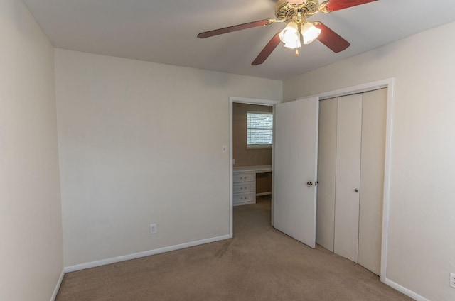 410 Shadywood Cir, Conroe, TX 77304 - unfurnished bedroom with light colored carpet, a closet, and ceiling fan