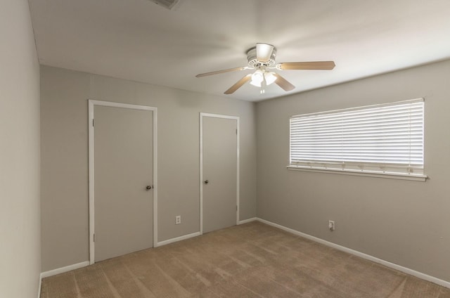 410 Shadywood Cir, Conroe, TX 77304 - unfurnished bedroom featuring carpet floors and a ceiling fan