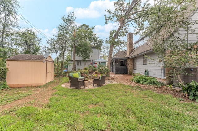 410 Shadywood Cir, Conroe, TX 77304 - view of grassy yard with a storage unit, an outdoor hangout area, and a patio