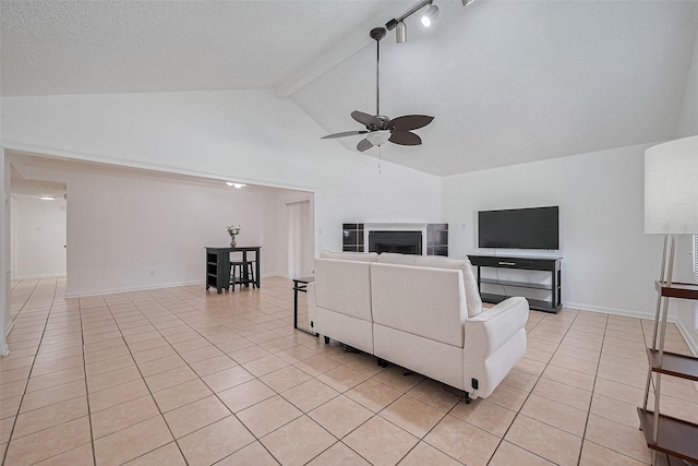 511 Walston Ln, Houston, TX 77060 - living room featuring light tile patterned floors, ceiling fan, high vaulted ceiling, beamed ceiling, and a textured ceiling