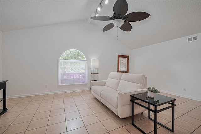 511 Walston Ln, Houston, TX 77060 - living room featuring a ceiling fan, a textured ceiling, and light tile patterned floors