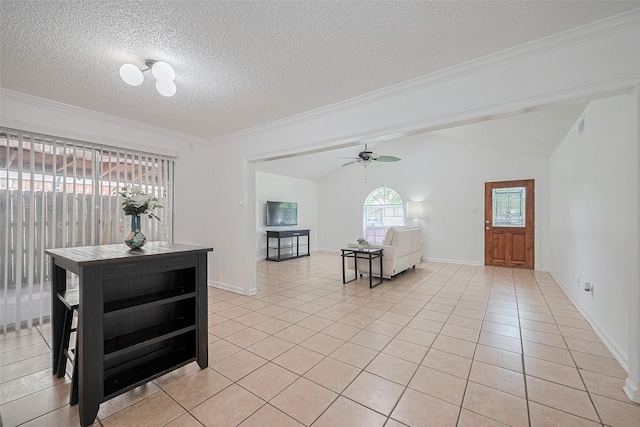 511 Walston Ln, Houston, TX 77060 - entrance foyer with light tile patterned floors, lofted ceiling, ceiling fan, a textured ceiling, and crown molding