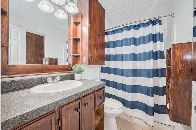511 Walston Ln, Houston, TX 77060 - bathroom with a textured ceiling, vanity, tile patterned flooring, and a shower with shower curtain