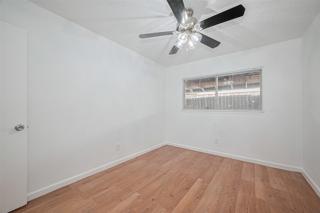 511 Walston Ln, Houston, TX 77060 - empty room featuring a textured ceiling, light wood-style flooring, and a ceiling fan