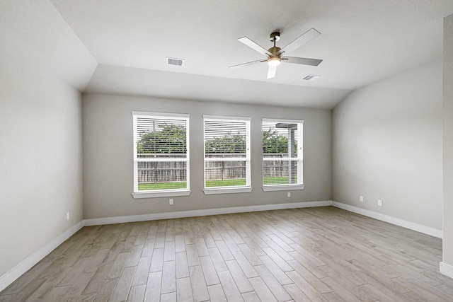 14715 Poplar Lake Trl, Cypress, TX 77429 - unfurnished room with lofted ceiling, healthy amount of natural light, light wood-style flooring, and ceiling fan