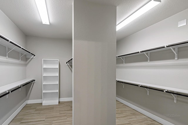14715 Poplar Lake Trl, Cypress, TX 77429 - spacious closet featuring light wood finished floors