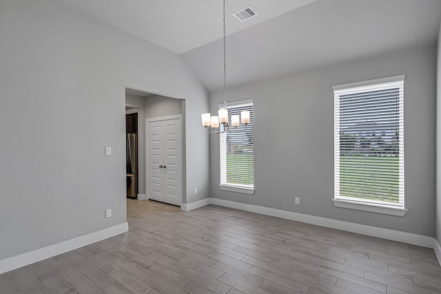 14715 Poplar Lake Trl, Cypress, TX 77429 - unfurnished room with a chandelier, wood finished floors, and lofted ceiling