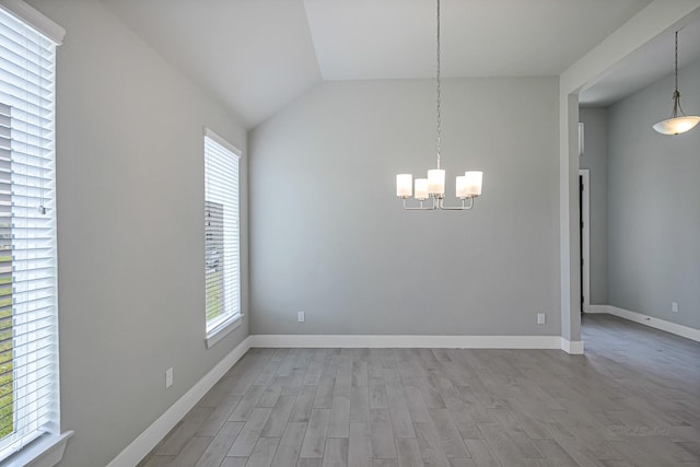 14715 Poplar Lake Trl, Cypress, TX 77429 - unfurnished dining area featuring wood finished floors, a chandelier, and vaulted ceiling