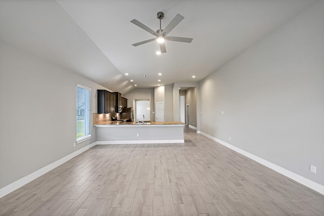 14715 Poplar Lake Trl, Cypress, TX 77429 - unfurnished living room featuring vaulted ceiling, light wood-style floors, a ceiling fan, and recessed lighting