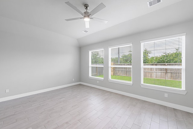 14715 Poplar Lake Trl, Cypress, TX 77429 - spare room featuring ceiling fan, light wood-style floors, and vaulted ceiling