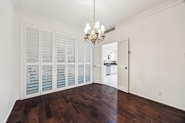 9333 Memorial Dr Unit 301, Houston, TX 77024 - unfurnished dining area featuring a chandelier, crown molding, and dark wood-style flooring