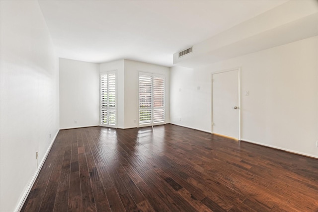 9333 Memorial Dr Unit 301, Houston, TX 77024 - unfurnished room with dark wood-style floors and baseboards