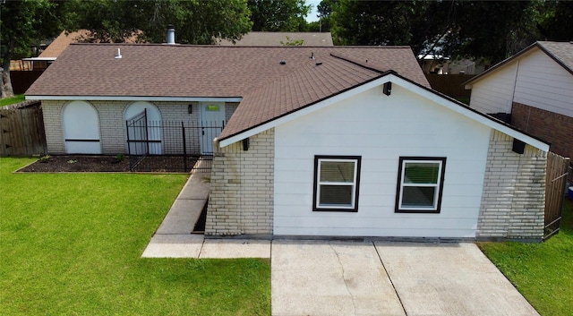 5030 Glenvalley Dr, La Porte, TX 77571 - back of house with brick siding, a shingled roof, and a patio