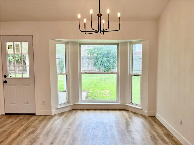 5030 Glenvalley Dr, La Porte, TX 77571 - unfurnished dining area with a chandelier and wood finished floors