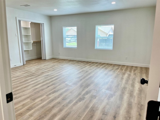 5030 Glenvalley Dr, La Porte, TX 77571 - unfurnished bedroom featuring wood finished floors, recessed lighting, and a closet