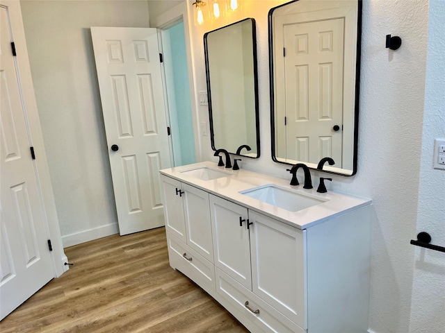 5030 Glenvalley Dr, La Porte, TX 77571 - bathroom with wood finished floors and double vanity