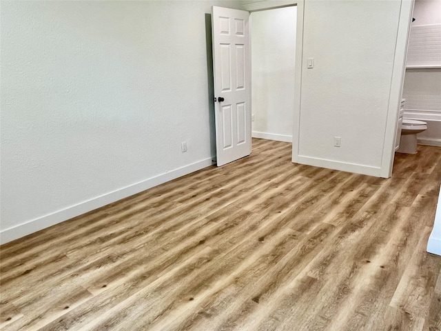 5030 Glenvalley Dr, La Porte, TX 77571 - unfurnished bedroom with baseboards and wood finished floors