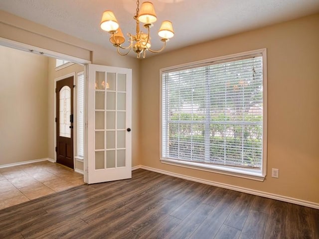 26610 W Surrey Park Ln W, Katy, TX 77494 - unfurnished dining area with a chandelier and wood finished floors